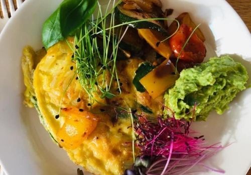 basil, chives, roasted vegis, guacamole, amaranth, volcano radish, on 2-egg omlett